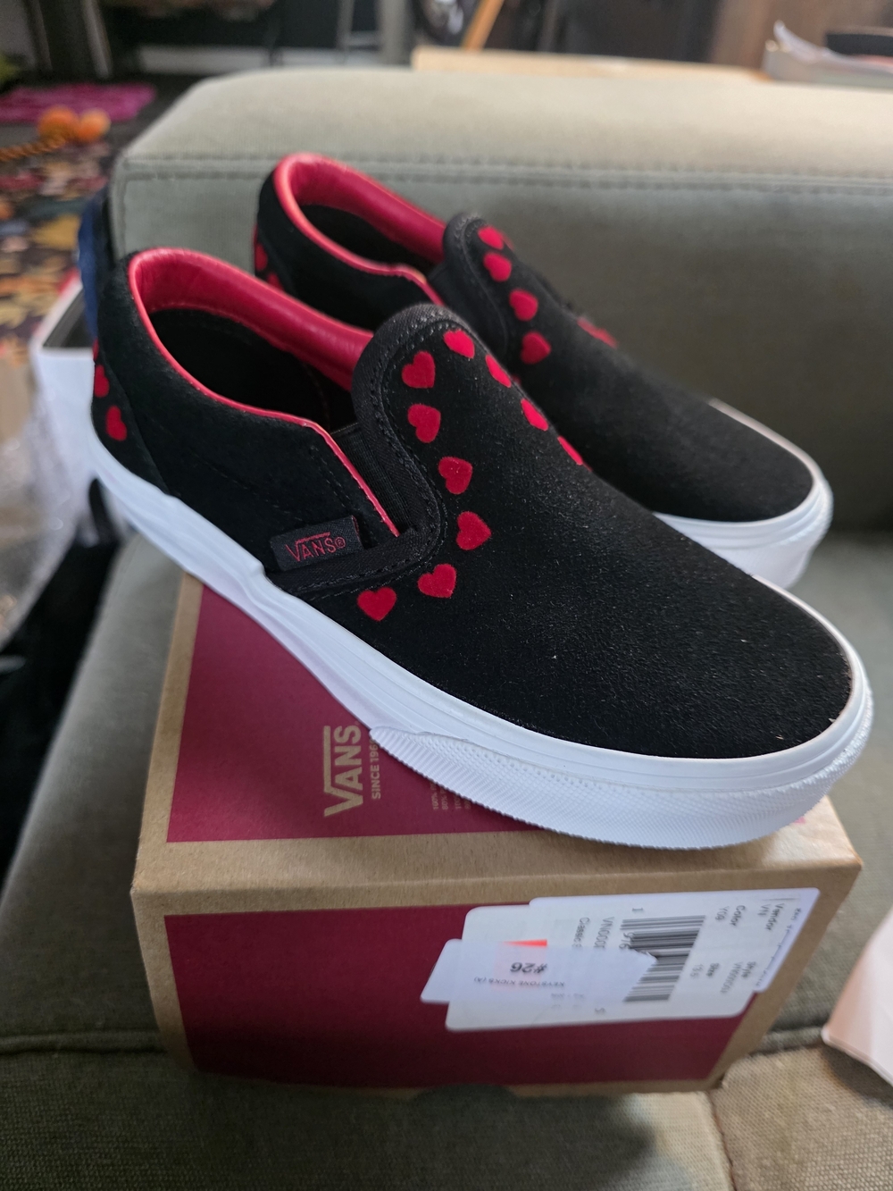 Vans Kids Slip-On Sneakers in Black with Red Hearts